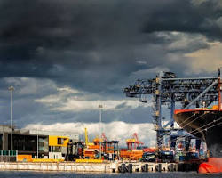 Cargo ship in a storm representing global trade war and economic crisis.